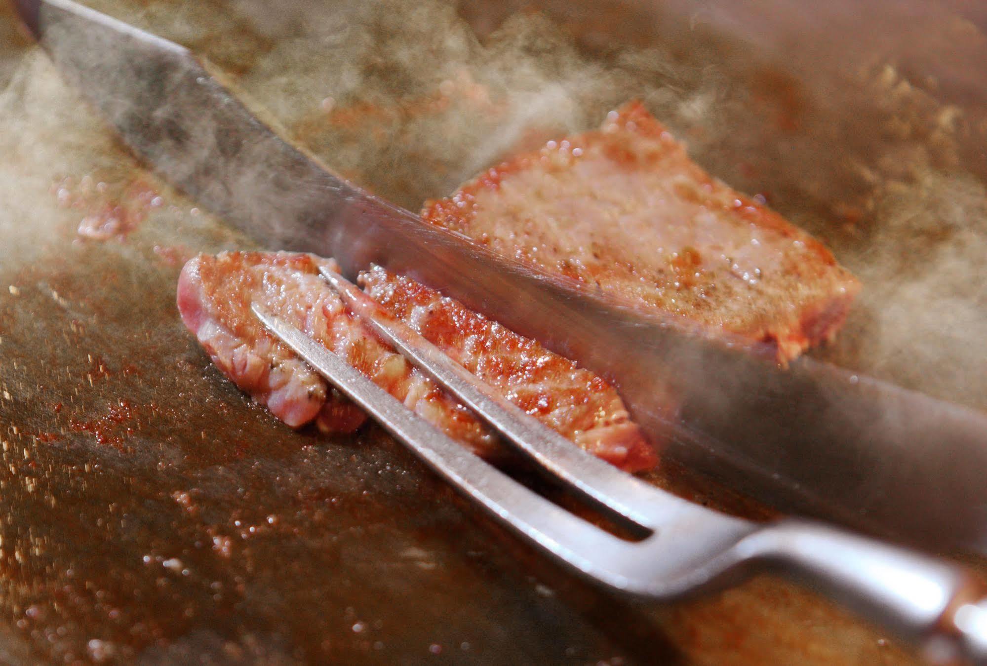 Hotel Asaya Nikko Zewnętrze zdjęcie A meat fork being used to serve meat